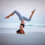 Young,Woman,Practice,Balance,Asanas,On,Summer,Yoga,Session,On